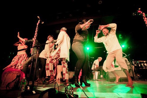 Group of dancers dancing onstage