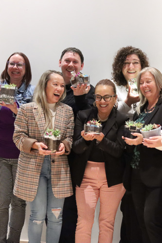 Group of people holding their terrariums